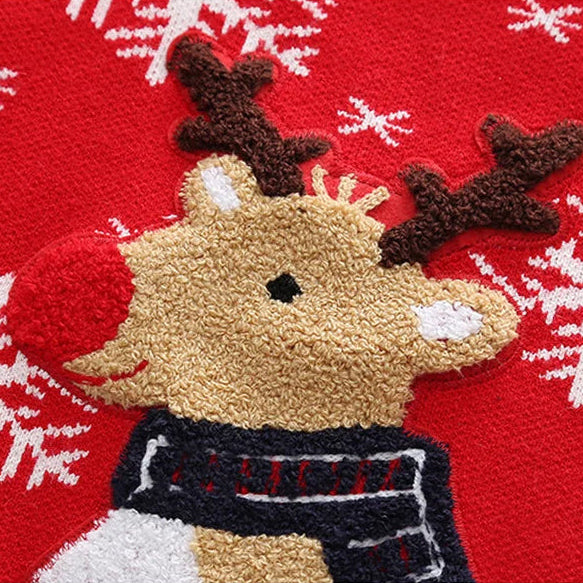Decorative reindeer patch on a red background with white snowflakes