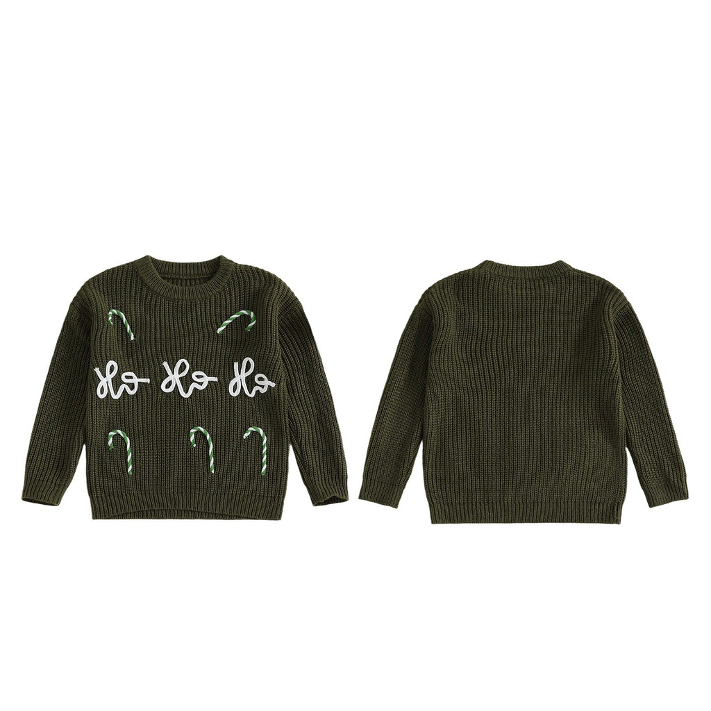 Green christmas jumper with white text and designs on a white background