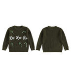 Green christmas jumper with white text and designs on a white background