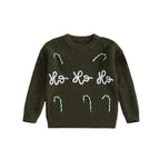 Green christmas jumper with 'Ho Ho Ho' text and candy cane designs on a white background