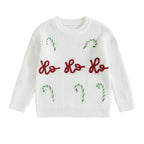 White christmas jumper with 'Ho Ho Ho' text and candy cane designs on a white background