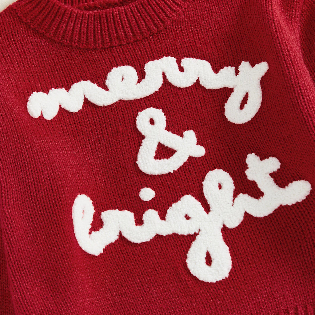 Red sweater with white text 'merry & bright' on a red background