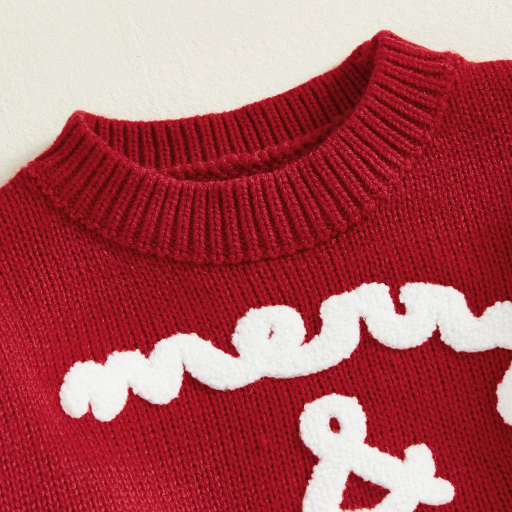 Red sweater with white 'merry &' text on a beige background