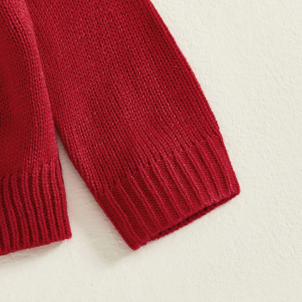 Close-up of a red knitted sleeve on a light background