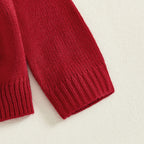 Close-up of a red knitted sleeve on a light background