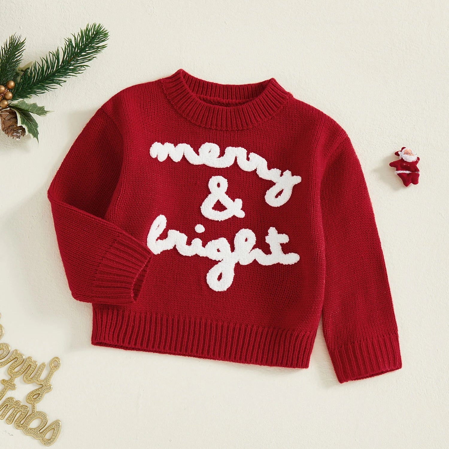 Red sweater with 'merry & bright' text on a light background