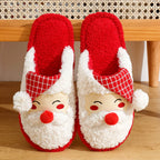 Red and white Santa Claus slippers on a wooden floor.