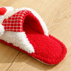 Red and white slipper on a wooden floor