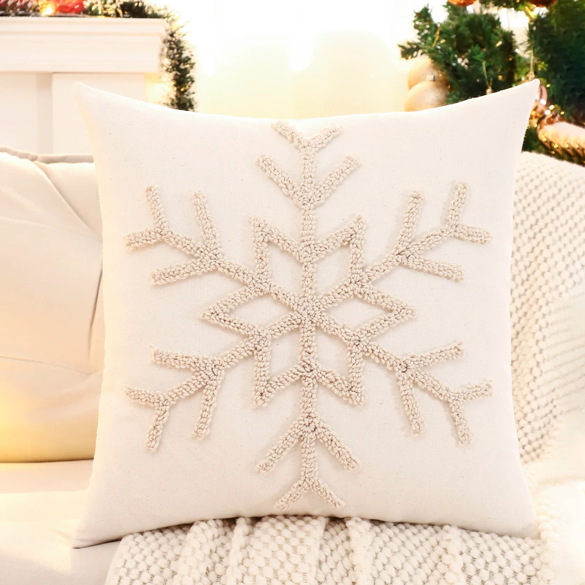 Decorative pillow with a snowflake pattern on a couch